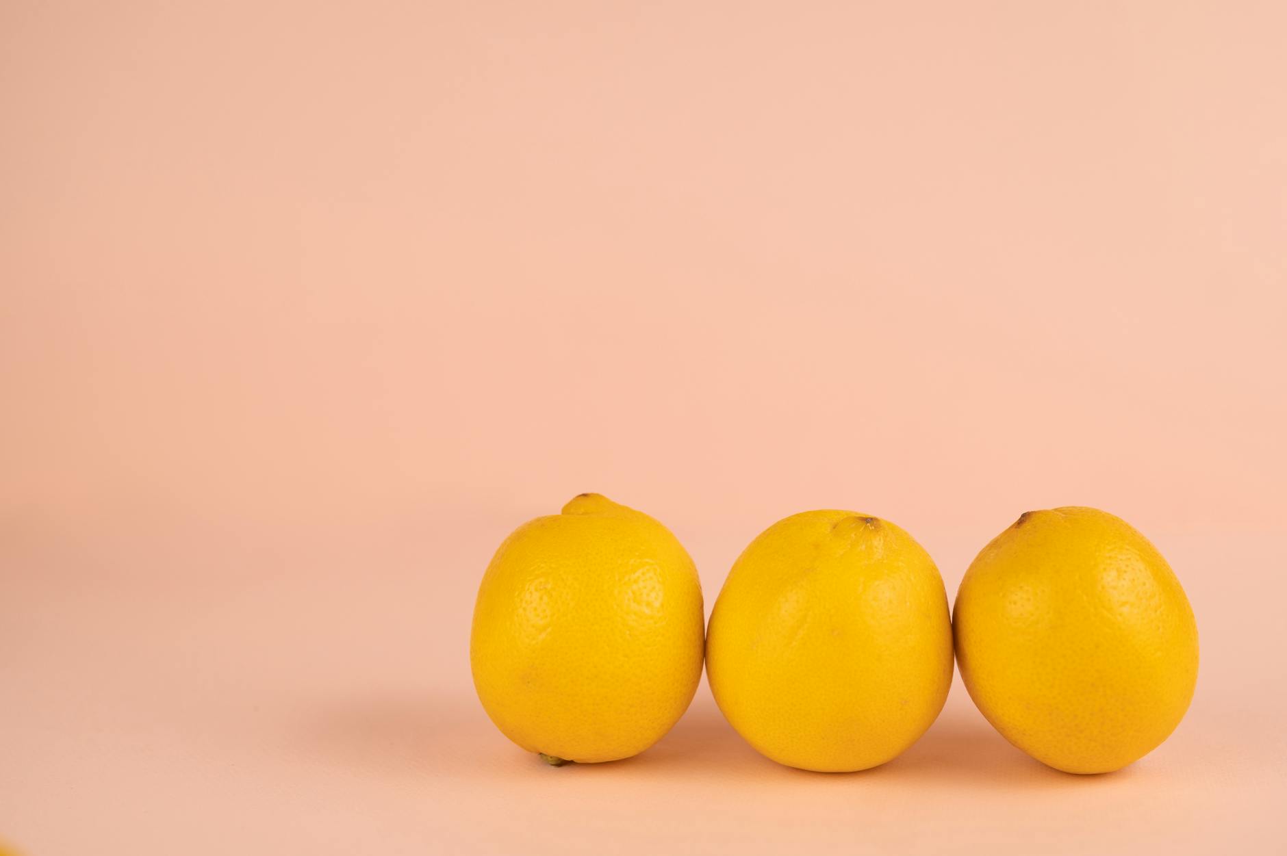Yellow silicone vibrator surrounded by fresh bananas on a bright yellow background